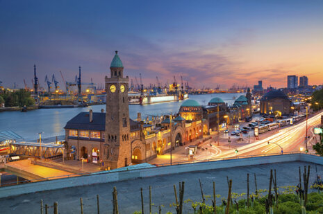 Landungsbruecken and the harbor at sunset in Hamburg