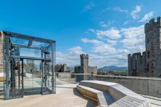 An image of the newly designed accessible visitors centre and viewing platform at Caernarfon Castle, Wales