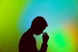 Man bows his head with stress