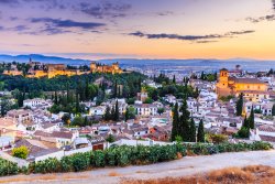 Alhambra at dusk overlooking the city of Granada.