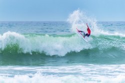 Man surfing, catching the waves