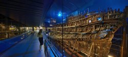 A woman examines the preserved remains of the Mary Rose in the Mary Rose Museum, Portsmouth