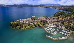 Aerial view of Lake Bolsena and the medieval village of Capodimonte in the Lazio region of Italy
