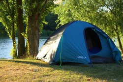 Tent on riverbank
