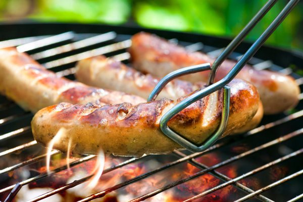 Sausages over a grill